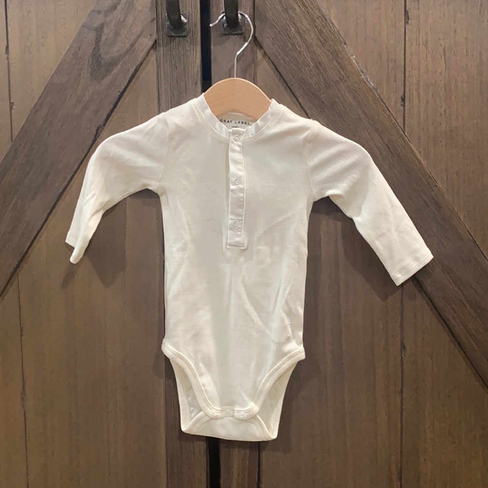 Gray label body suit, never worn. New without tags.